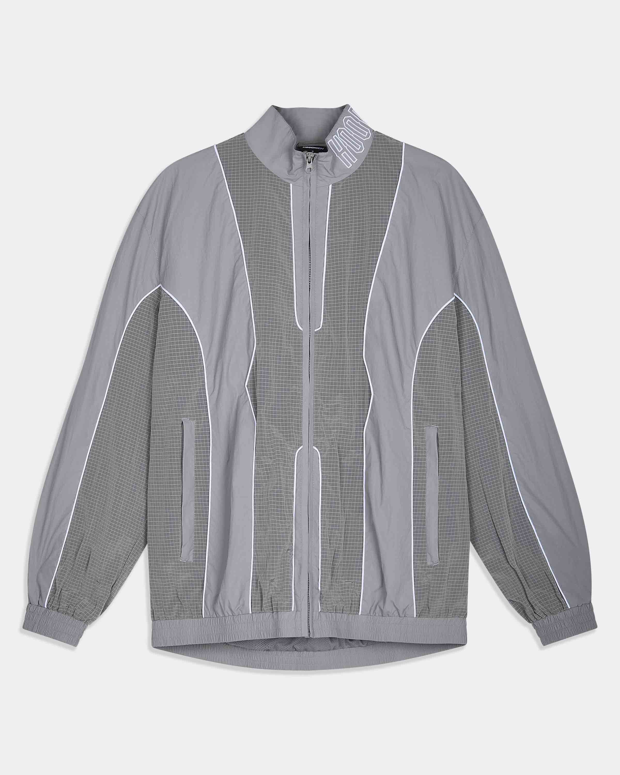 A gray zip-up jacket with a subtle grid pattern on the sleeves and front panels, featuring white piping details and a high collar, shown against a light gray background.
