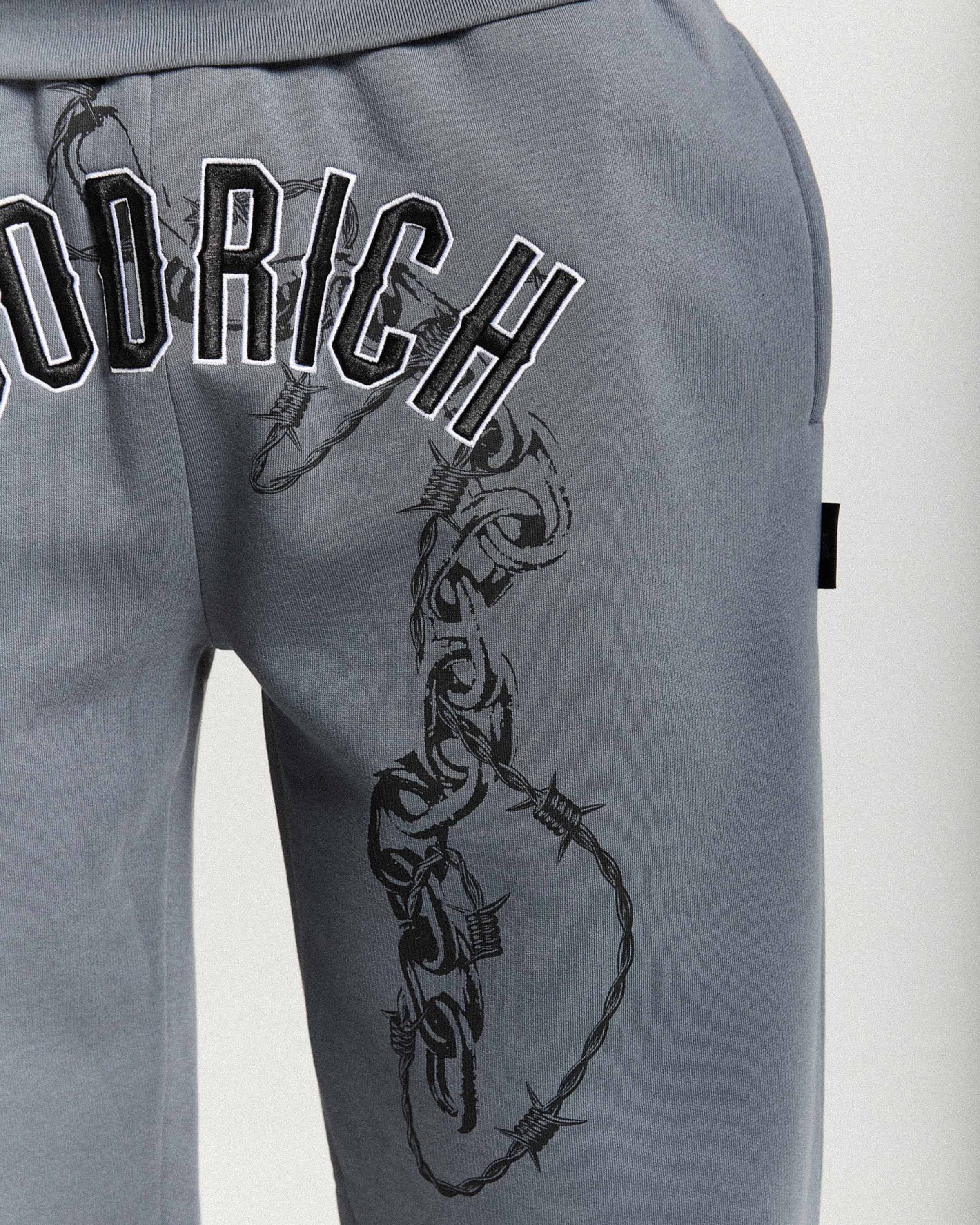 Gray sweatpants with barbed wire design and 'Hoodrich' branding on a white background