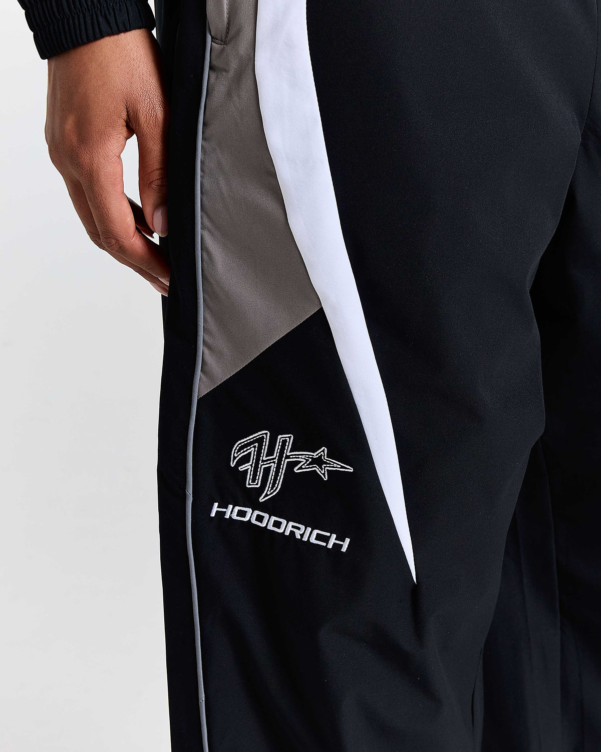 Black jacket with gray and white accents featuring the 'Hoodrich' brand logo.