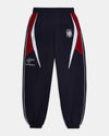 Navy tracksuit pants with red and white accents on a white background