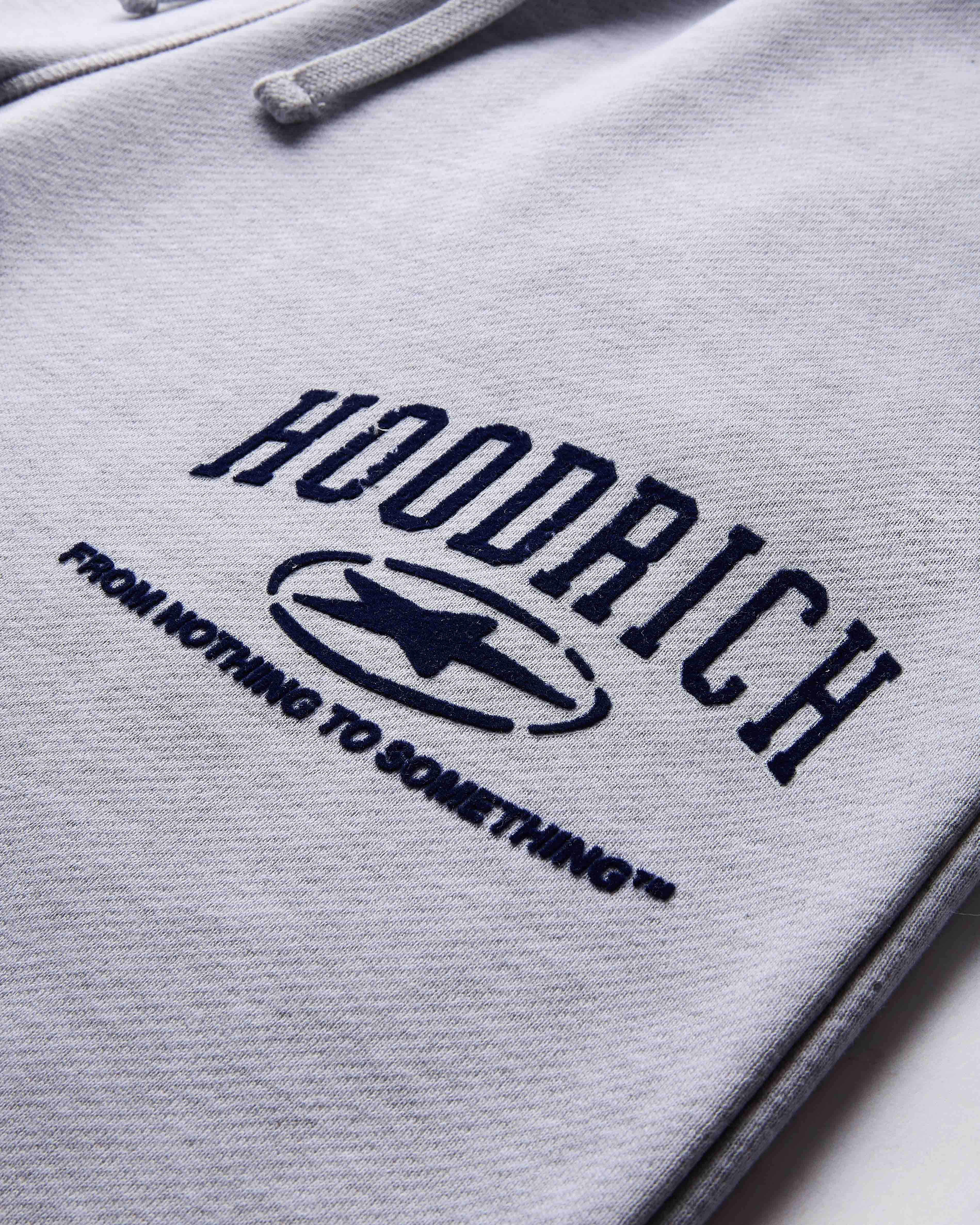 Gray hoodie with 'Hoodrich' logo and text on a light gray background