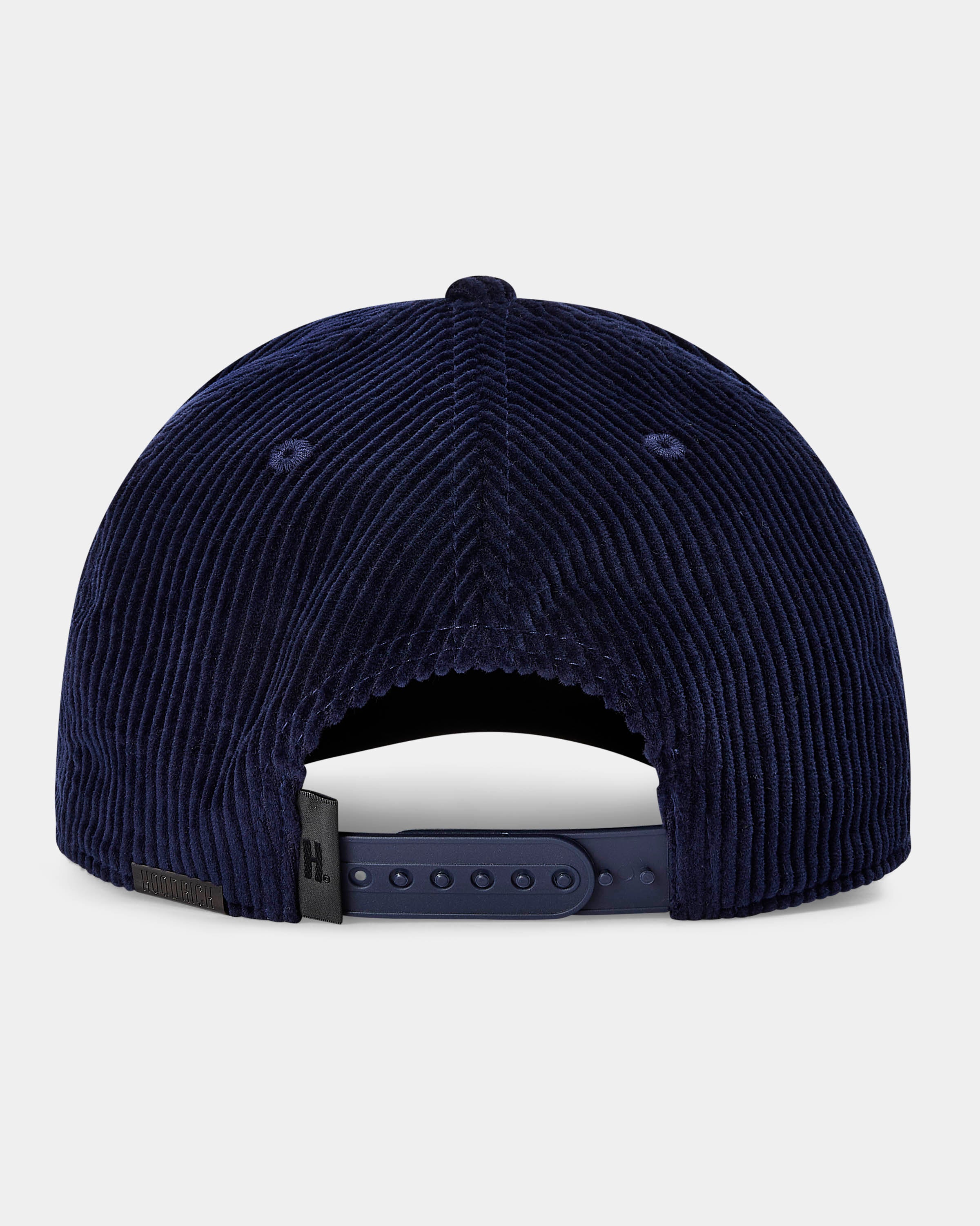 Navy blue corduroy cap on a light gray background
