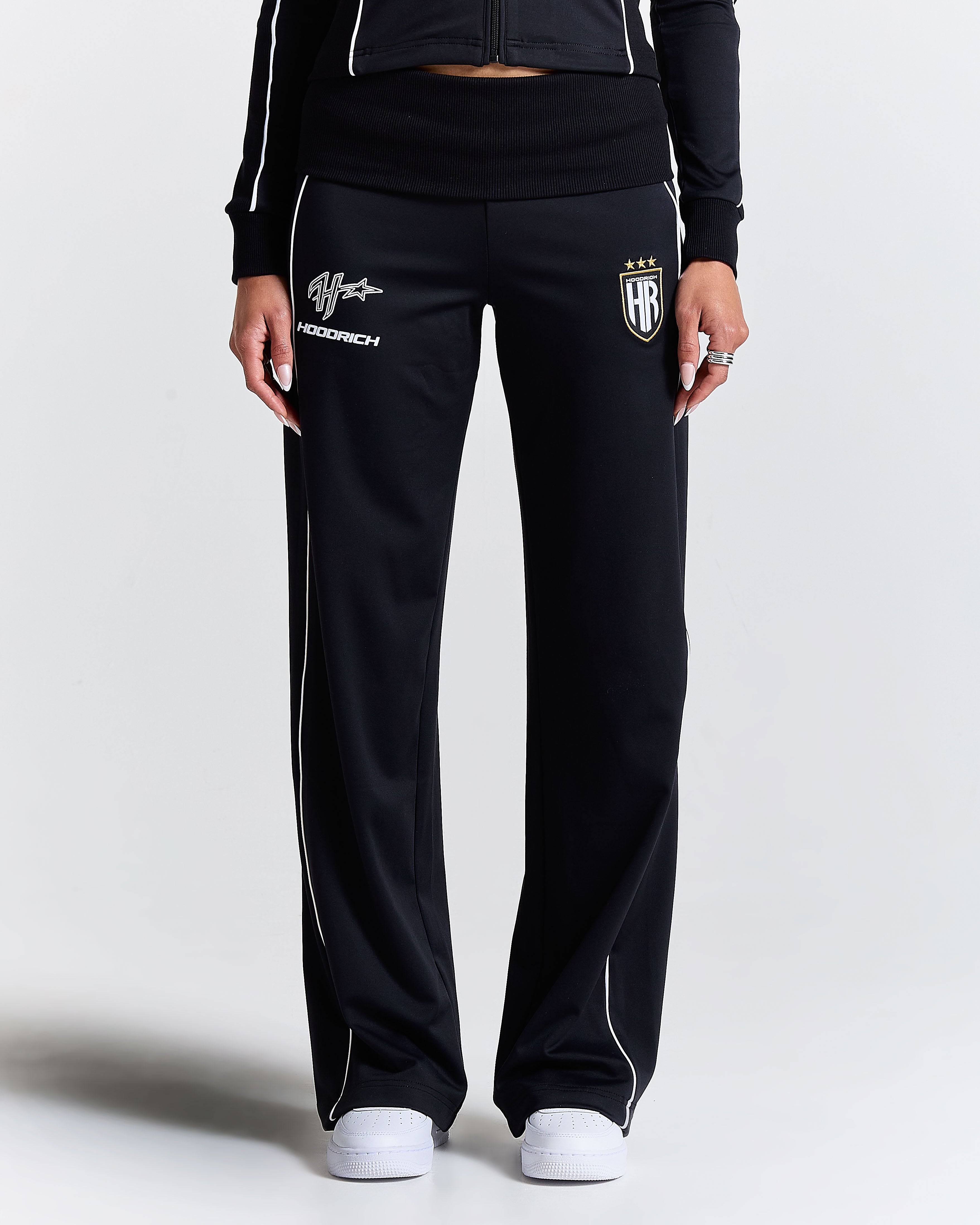 Black tracksuit with brand logos on a white background