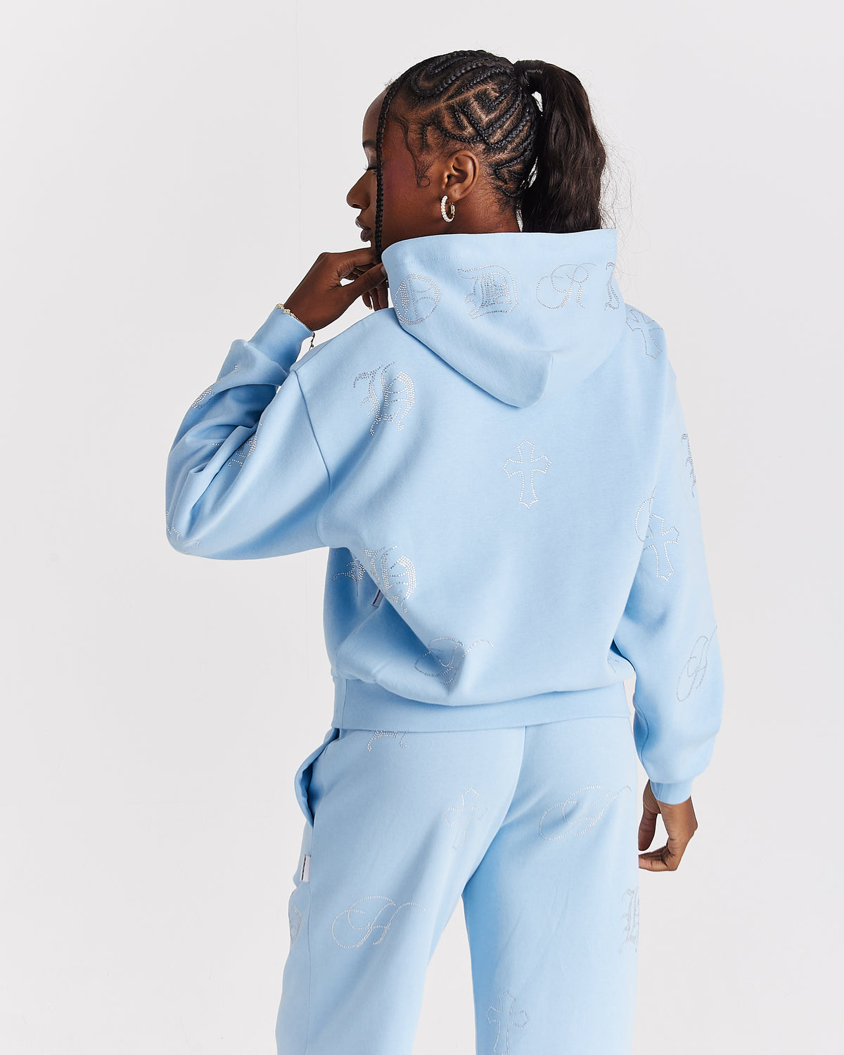 Displays a model wearing the blue 'Hoodrich' branded women's Crystal Full Tracksuit