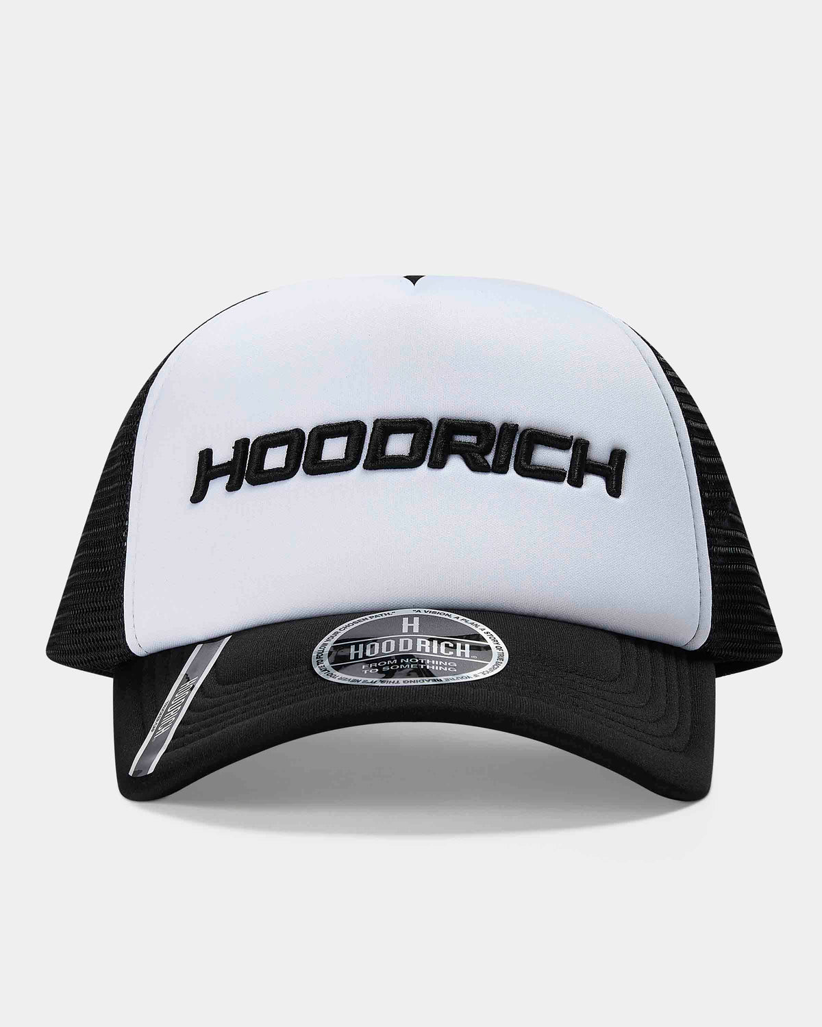 A black and white trucker hat with 'HOODRICH' embroidered in black across the white front panel and a silver reflective accent on the brim.